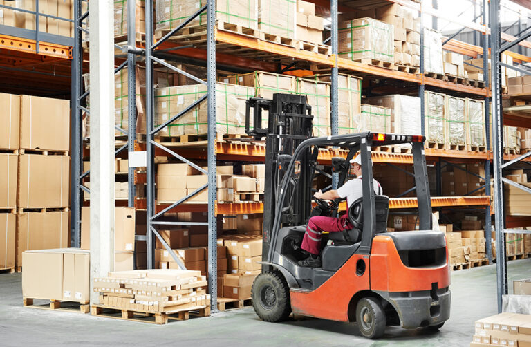 Warehouse,Worker,Driver,In,Uniform,Loading,Cardboard,Boxes,By,Forklift